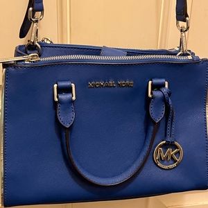 Michael Kors blue crossbody adjustable to shoulder bag.